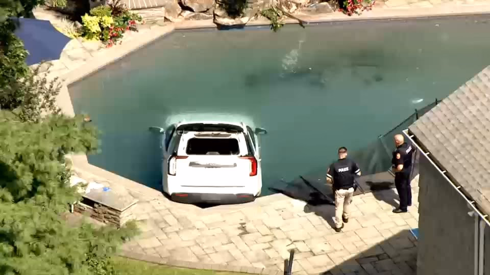 White SUV Submerged in Hewlett Backyard Pool After Jumping Fence on Elinor Road